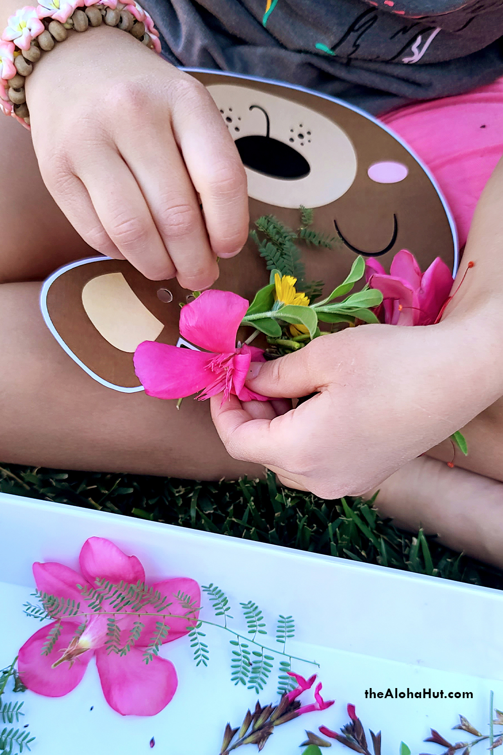 flower crown threading activity by the Aloha Hut