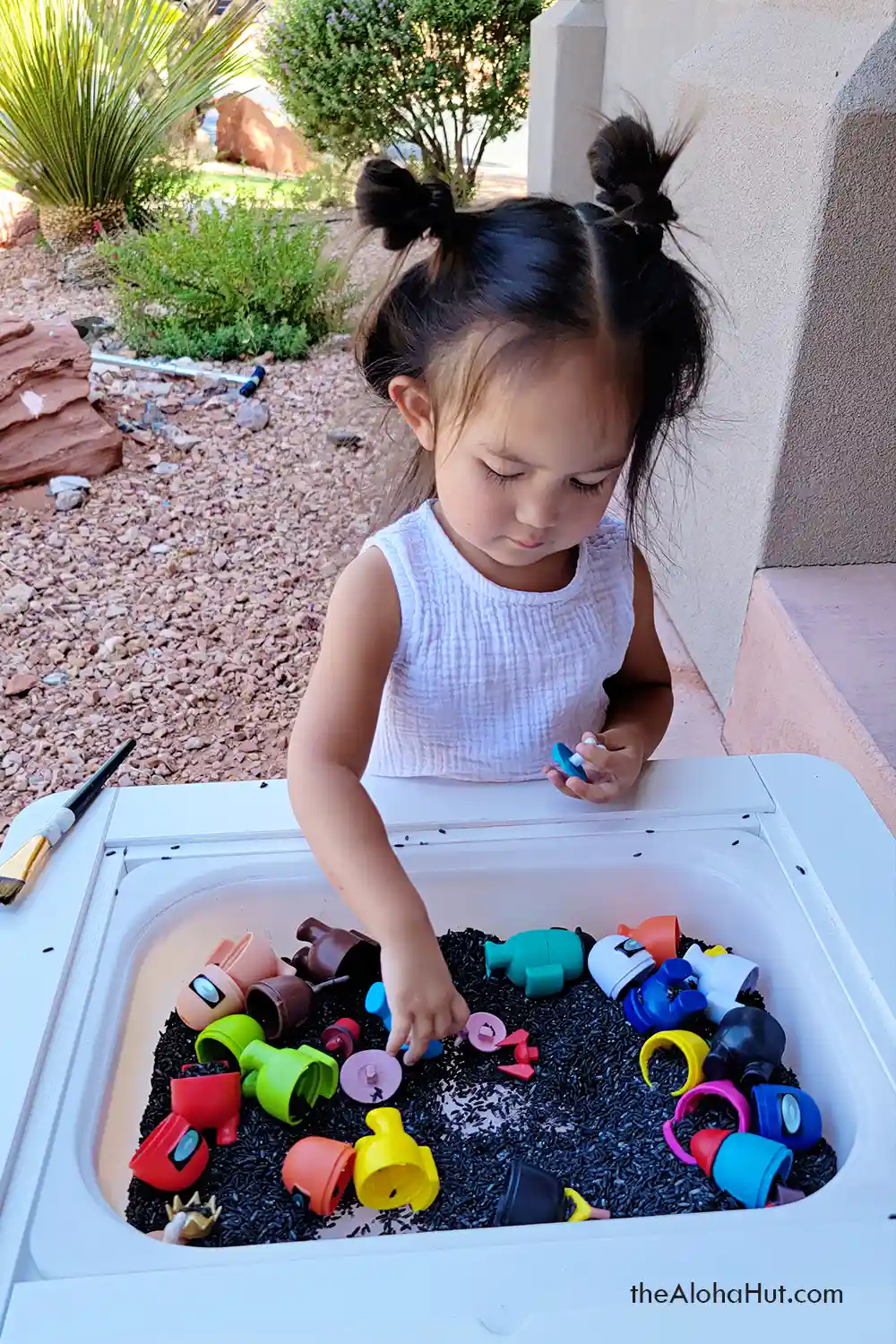 Among Us sensory table activity idea for kids, toddlers, and preschoolers. Download the printable I Spy Among Us game and instructions for an easy and fun kids sensory activity!