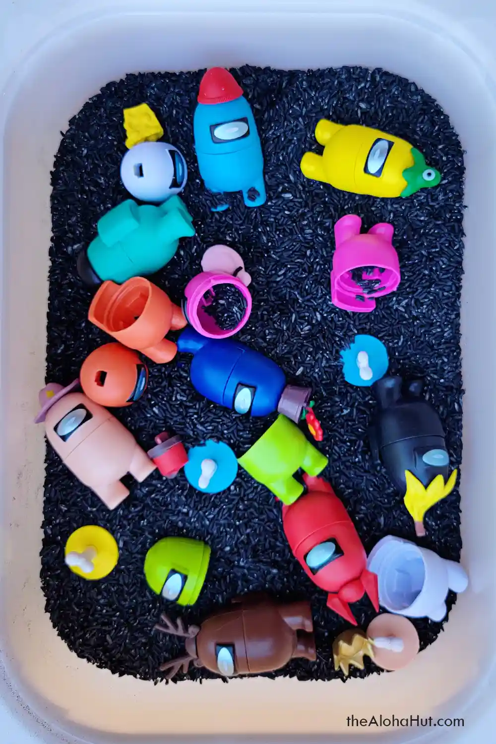 Among Us sensory table activity idea for kids, toddlers, and preschoolers. Download the printable I Spy Among Us game and instructions for an easy and fun kids sensory activity!