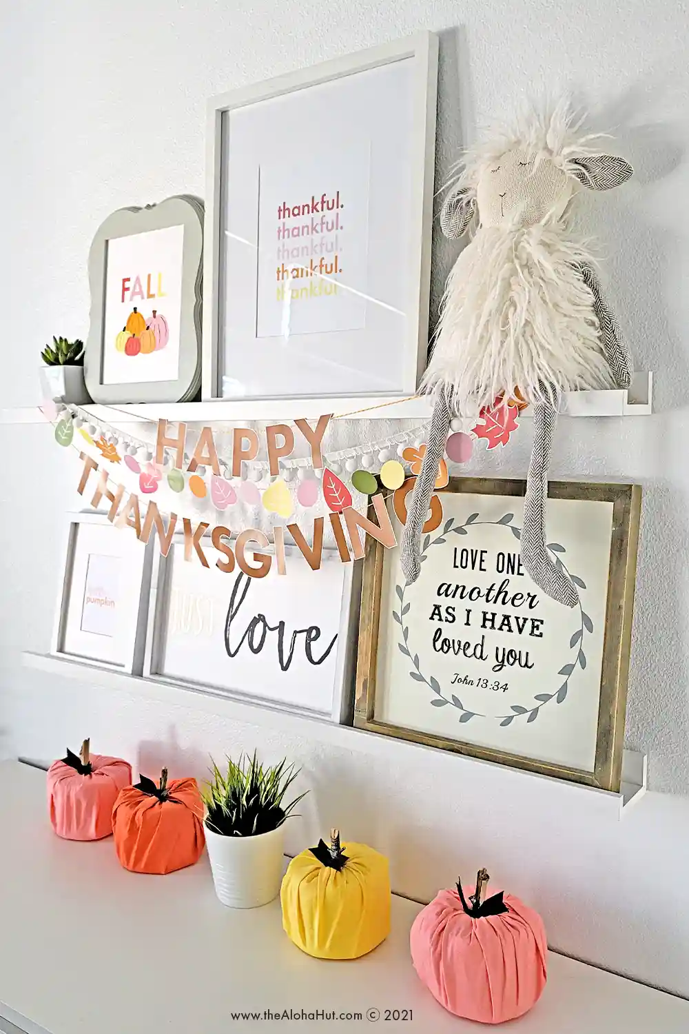 Printable Fall art prints and Thanksgiving art prints for easy DIY decor on a budget this Fall. Also has easy DIY garlands that say Happy Thanksgiving and then a garland of colorful Fall leaves.
