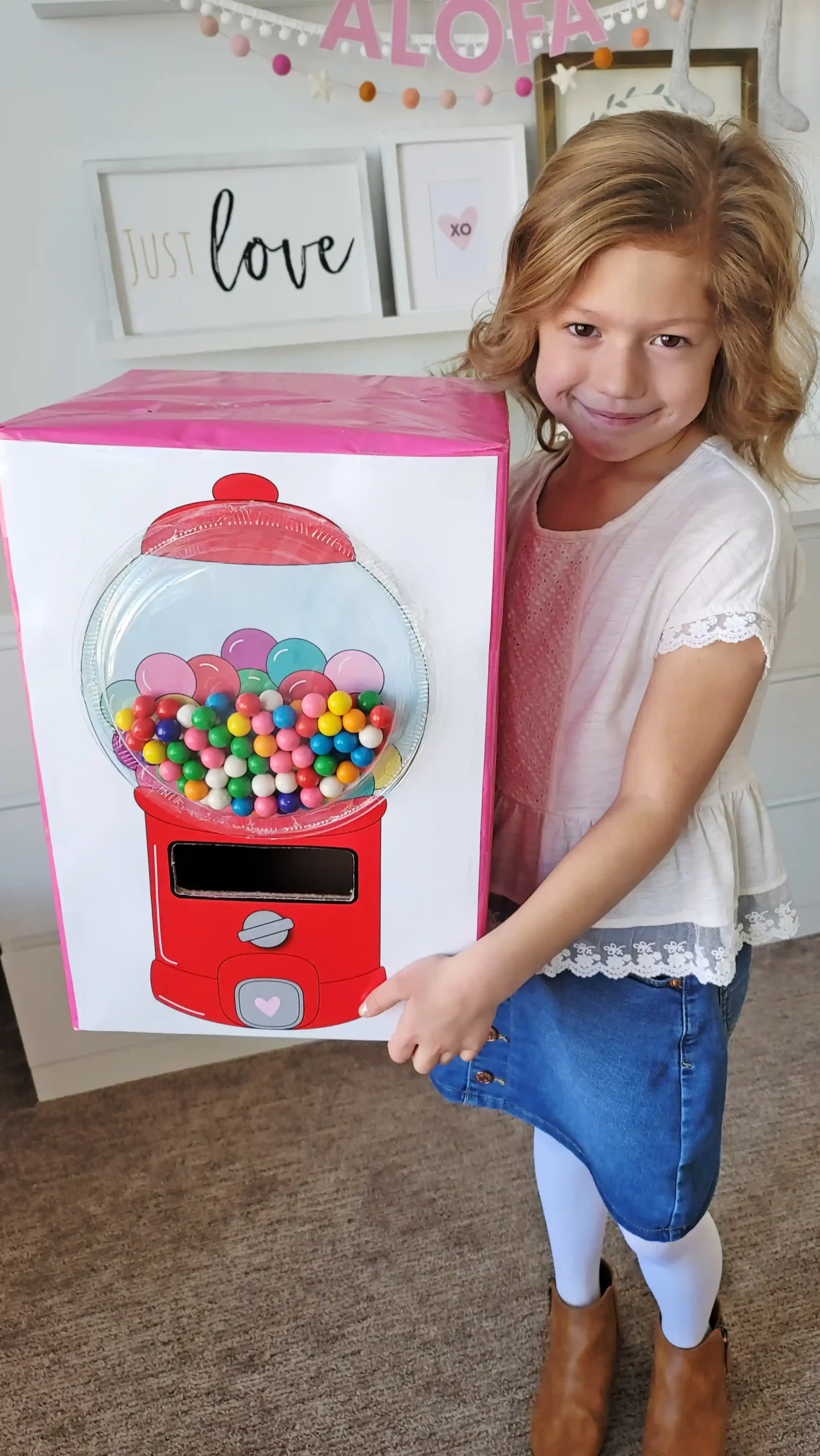 How to make a Valentine's Day gumball machine box for kids. Includes step by step instruction with a printable red or pink gumball machine, all the supplies you need to make a DIY homemade valentine box!